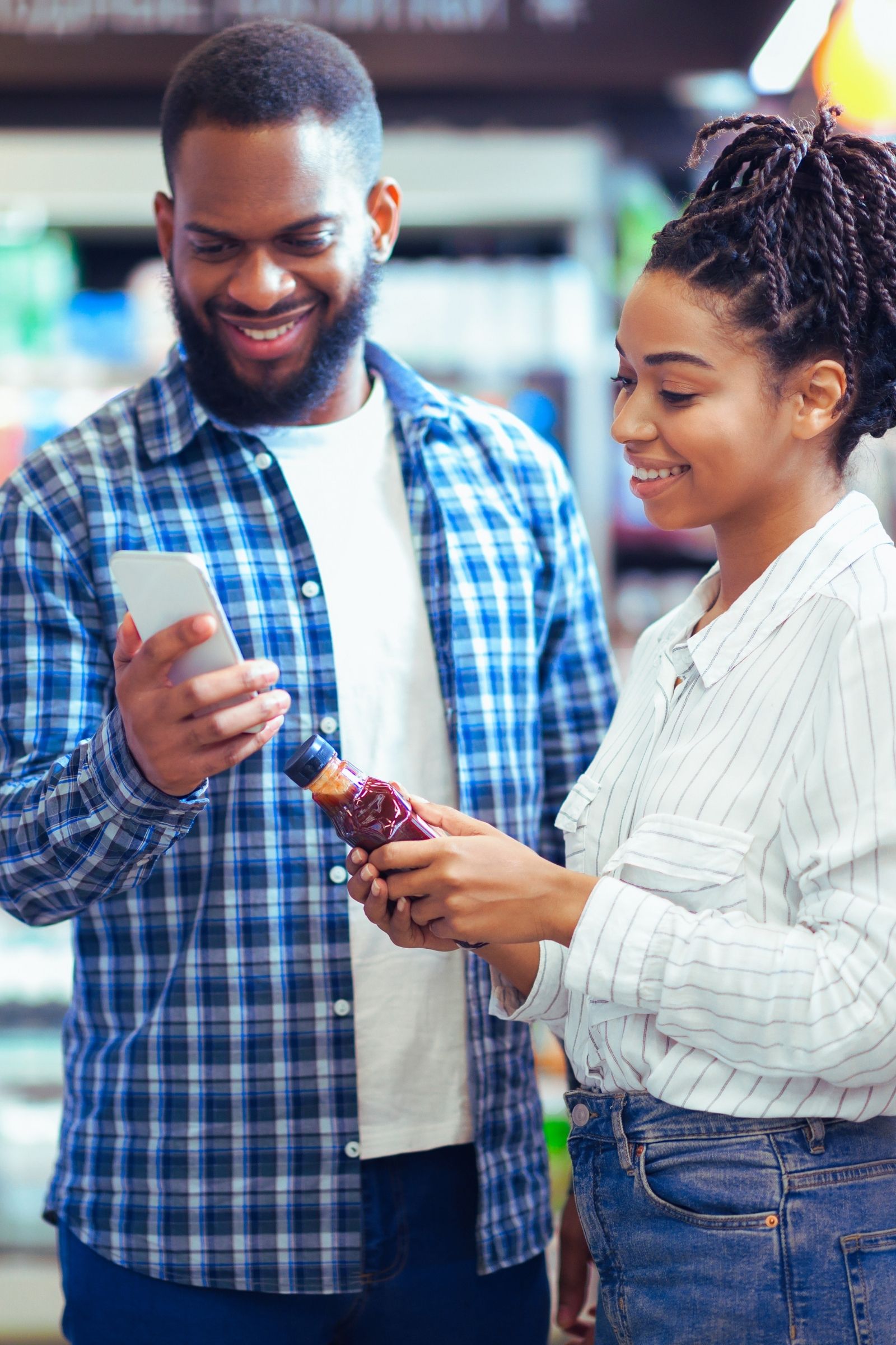 Customers using the NDM Market app while shopping